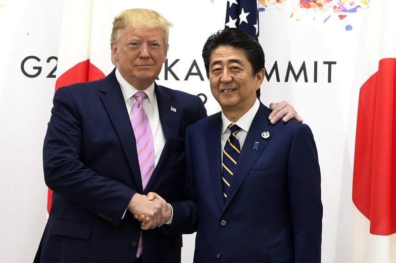 President Donald Trump meets with Japanese Prime Minister Shinzo Abe during a meeting on the sidelines of the G-20 summit in Osaka, Japan, Friday, June 28, 2019. (AP Photo/Susan Walsh)