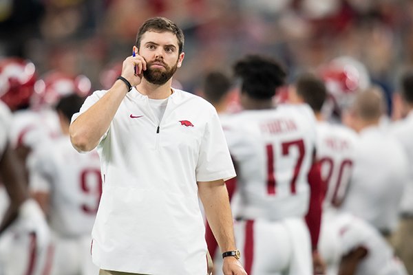 Arkansas special assistant SJ Tuohy watches pregame warmups prior to a game against Texas A&M on Saturday, Sept. 29, 2018, in Arlington, Texas. 