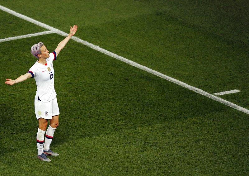 United States' Megan Rapinoe celebrates after scoring her side's second goal during the Women's World Cup quarterfinal soccer match between France and the United States at the Parc des Princes, in Paris, Friday, June 28, 2019. (AP Photo/Francois Mori)