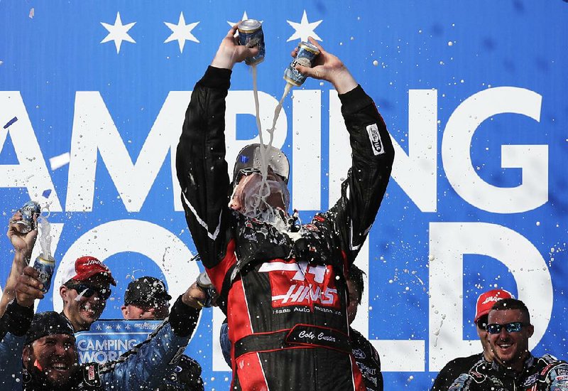 Cole Custer celebrates in Victory Lane on Saturday after winning the Camping World 300 NASCAR Xfinity Series race at Chicagoland Speedway in Joliet, Ill.
