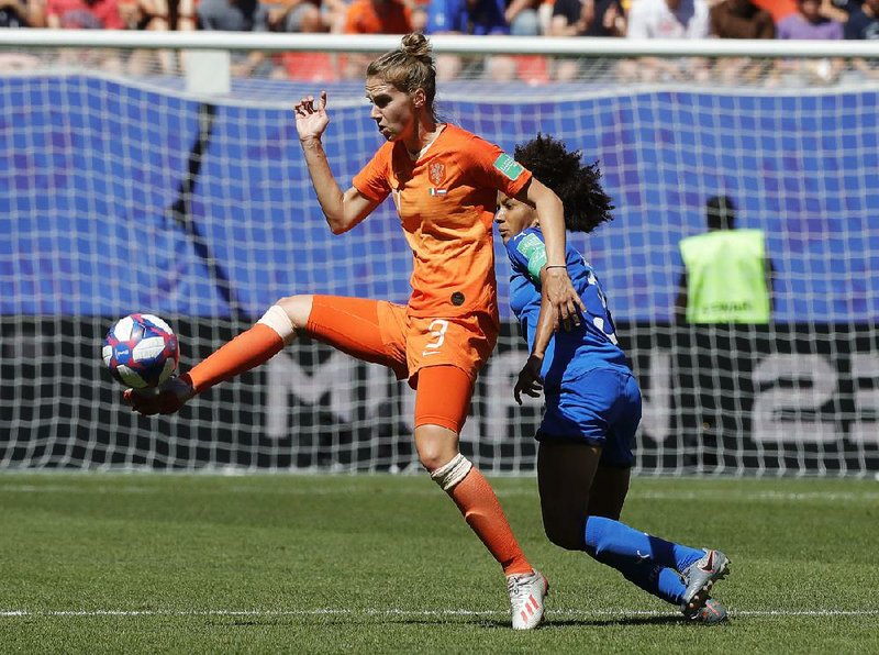 Vivianne Miedema (right) of the Netherlands and Sara Gama of Italy challenge for the ball during a Women’s World Cup quarterfinal Saturday at the Stade du Hainaut stadium in Valenciennes, France. Miedema scored in the 70th minute to claim her 61st goal in 80 appearances for the Netherlands, which won 2-0.