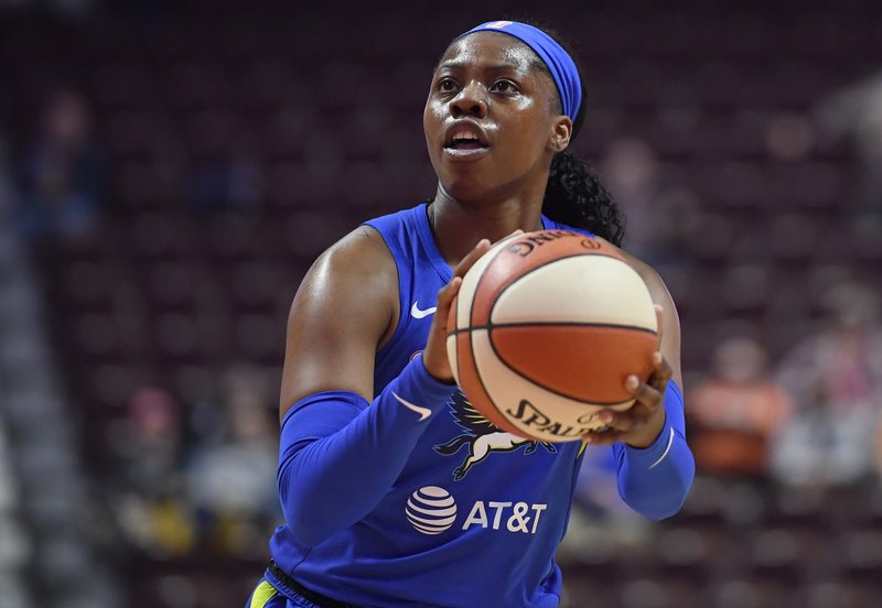 FILE - In this May 14, 2019, file photo, Dallas Wings' Arike Ogunbowale eyes the basket during the first half of the team's preseason WNBA basketball game against the Connecticut Sun in Uncasville, Conn. Ogunbowale was 2 for 23 from the field Friday, June 28, against the New York Liberty, which was the worst shooting night in WNBA history for a player taking more than 20 shots in a game. (AP Photo/Jessica Hill, File)