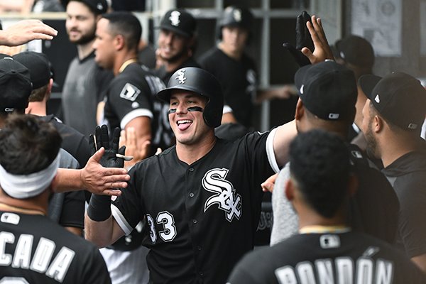 Chicago White Sox's James McCann (33) celebrates in the dugout after he hit a two-run home run during the first inning of a baseball game against the Minnesota Twins on Friday, June 28, 2019, in Chicago. (AP Photo/Matt Marton)

