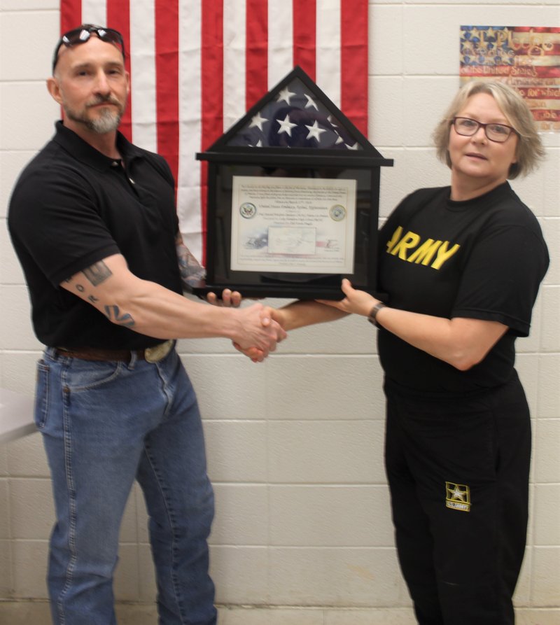 Submitted photo
PRESENTATION: LTC Myra Shepherd, Senior Army instructor of the Lake Hamilton High School JROTC program, receives a flag that flew over the U.S. Embassy in Afghanistan from Kevin Yeagle, left.