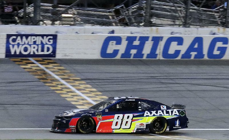 Alex Bowman crosses the finish line to win the NASCAR Cup Series race at Chicagoland Speedway on Sunday in Joliet, Ill. It was Bowman’s first Cup series victory.