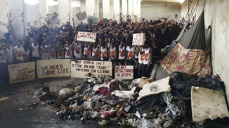 A May 21 photo taken by an African migrant shows hundreds of migrants staging a protest in a detention center in Zintan, Libya, while appealing for help from the United Nations. 