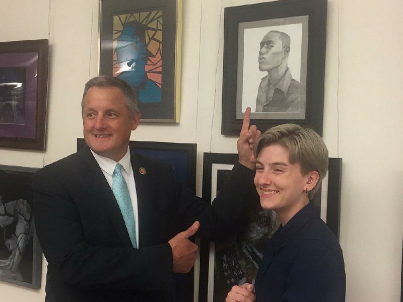 U.S. Rep. Bruce Westerman points out Tracy Gwinn’s winning artwork, Portrait 2, on June 24. Tracy (right), a recent graduate of the Arkansas School for Mathematics, Science and the Arts, was the winning artist in Westerman’s district and her artwork will hang this year in the tunnel connecting House office buildings to the U.S. Capitol. 