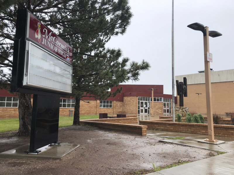 ** HOLD FOR STORY ** This June 20, 2019 photo shows McCormick Junior High School, in Cheyenne, Wy. School officials in Cheyenne are addressing the aftermath of racist and anti-gay flyers distributed by junior-high students. The leaflets at McCormick Junior High School in March told pre-teens to &quot;Join the KKK&quot; and that &quot;It's not OK to be gay.&quot; A district response plan calls for hiring a counselor and providing more training to help employees report and investigate harassment. (AP Photo/Mead Gruver)