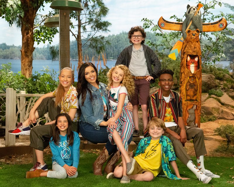 Scarlett Estevez (left), Shelby Simmons, Miranda May, Mallory James Mahoney, Raphael Alejandro, Will Buie Jr. and Israel Johnson star in the Disney Channel series Bunk’d. The show, set at a summer camp, is a spinoff of another Disney series — Jessie.
