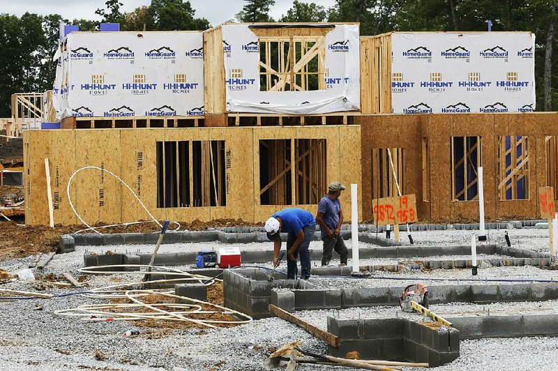 Work continues last month on a townhouse in Mechanicsville, Va. Spending on residential construction declined in May, according to the Commerce Department. 