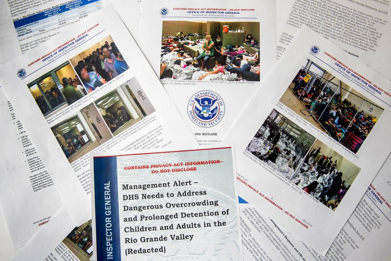 A portion of a report from government auditors reveals images of people penned into overcrowded Border Patrol facilities, photographed Tuesday, July 2, 2019, in Washington. The report released Tuesday by the Department of Homeland Security's Office of Inspector General warns that facilities in South Texas' Rio Grande Valley face "serious overcrowding" and require "immediate attention." (AP Photo/Andrew Harnik)