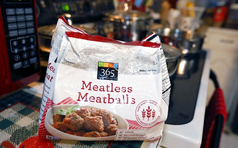 A federal lawsuit says Mississippi is violating free-speech rights by banning makers of plant-based foods from using terms such as "meatless meatballs," "vegan bacon," "beefless burger" or "beefless tips," as displayed in a Jackson, Miss., home, Tuesday, July 2, 2019. The lawsuit was filed Monday by the Plant Based Foods Association and the Illinois-based Upton's Naturals Co., which makes vegan products and sells them in many states, including Mississippi. It was filed the same day Mississippi enacted a new law that bans plant-based products from being labeled as meat. (AP Photo/Rogelio V. Solis)