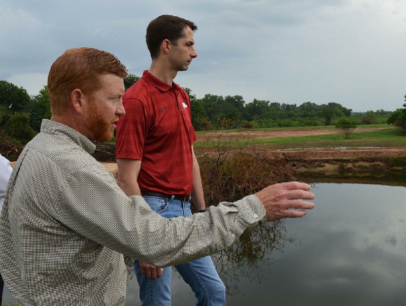 Jonathan Palmer, civil engineer for the U.S. Army Corps of Engineers, tells Sen. Tom Cotton, R-Ark., about the temporary repairs on the Lollie Levee in Faulkner County and what the future holds for the structure.