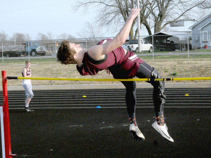 MARK HUMPHREY ENTERPRISE-LEADER Lincoln sophomore Eli Rich competes in the high jump during the first-ever Wolf Relays track and field meet hosted by Lincoln High School on Thursday, March 28, 2019. Rich finished fourth reaching a height of 5-06, yet continued to improve. Rich cleared 6-o for second place at the 3A-1 West Conference meet April 22 at Mansfield; and qualified for the State 3A meet held April 30 at Green Forest where he placed eighth with a jump of 5-10.