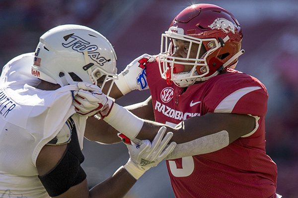 Arkansas defensive end Dorian Gerald goes up against a Tulsa offensive lineman during a game Saturday, Oct. 20, 2018, in Fayetteville.