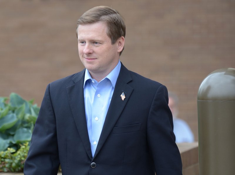 Consultant Randell G. Shelton Jr. walks Tuesday, May 1, 2018, out of the John Paul Hammerschmidt Federal Building in Fayetteville.