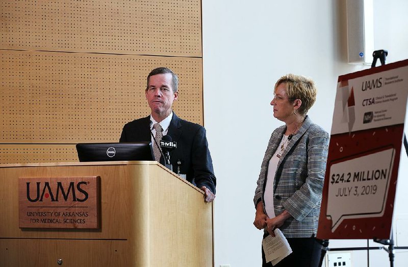 University of Arkansas for Medical Sciences Chancellor Cam Patterson announces the grant Wednesday with Laura James, director of the Translational Research Institute at UAMS. Patterson called the award “a big deal” for UAMS and the state. 