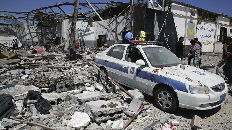 A migrant detention center is reduced to rubble Wednesday after an airstrike in the Tajoura neighborhood of Tripoli, Libya. 