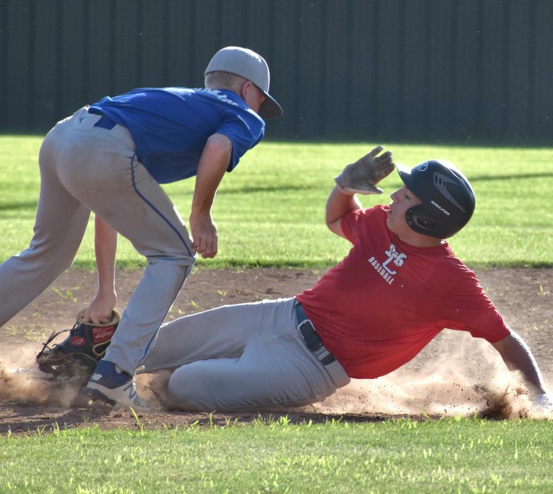 RICK PECK/SPECIAL TO MCDONALD COUNTY PRESS McDonald County's Destyn Dowd beats a throw to second base during a 2-2 tie against Carthage on June 26 at MCHS.