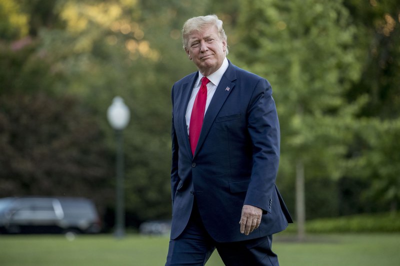 In this June 30, 2019 file photo, President Donald Trump walks across the South Lawn as he arrives at the White House in Washington.   (AP Photo/Andrew Harnik, File)