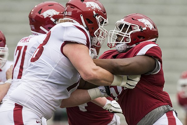 Arkansas defensive end Eric Gregory (right) is shown during the Razorbacks' Red-White Game on Saturday, April 6, 2019, in Fayetteville.