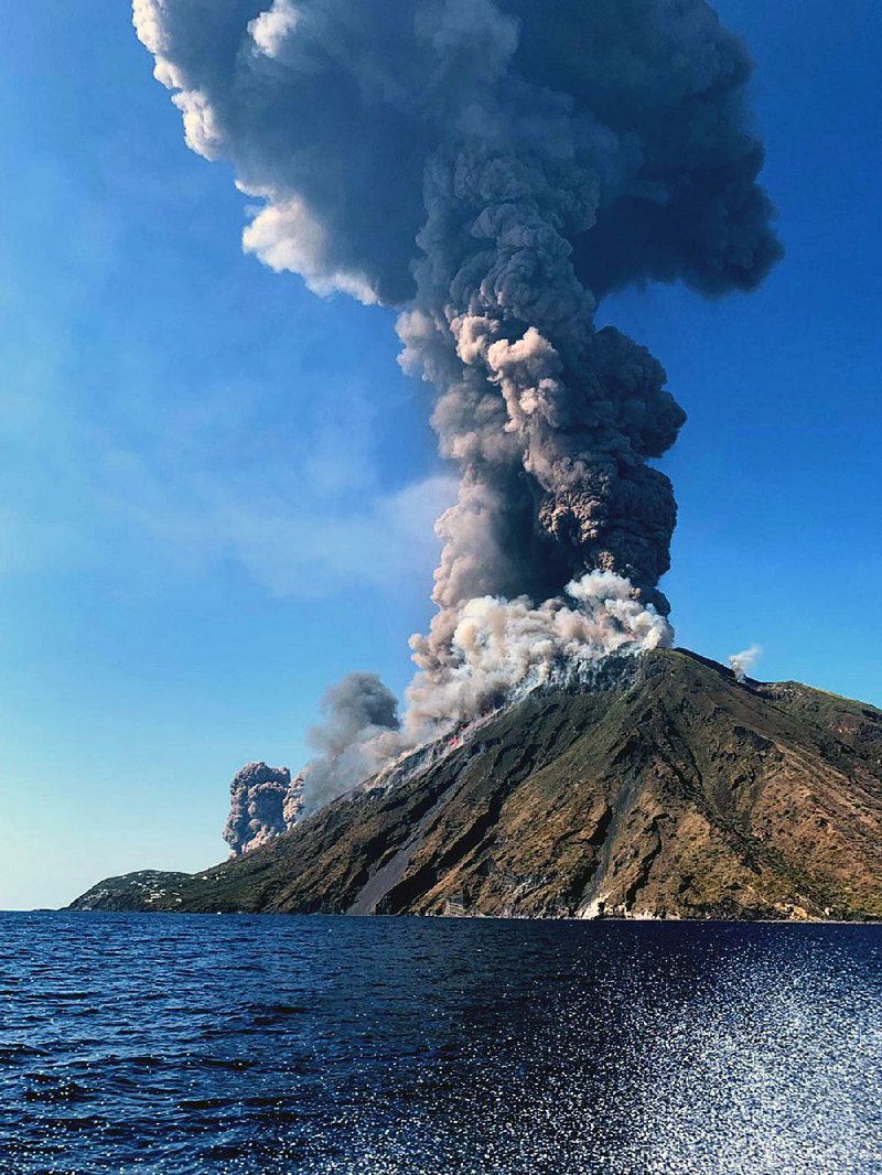 Smoke billows from the volcano on the Sicilian island of Stromboli, where civil protection authorities said a hiker was confirmed killed by the eruptions Wednesday. 