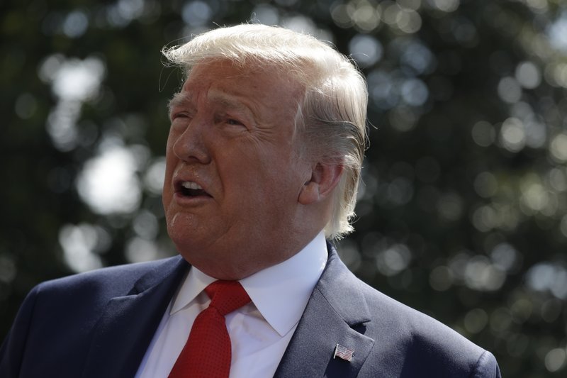 President Donald Trump talks to reporters on the South Lawn of the White House before departing for his Bedminster, N.J. golf club, Friday, July 5, 2019, in Washington. (AP Photo/Evan Vucci)

