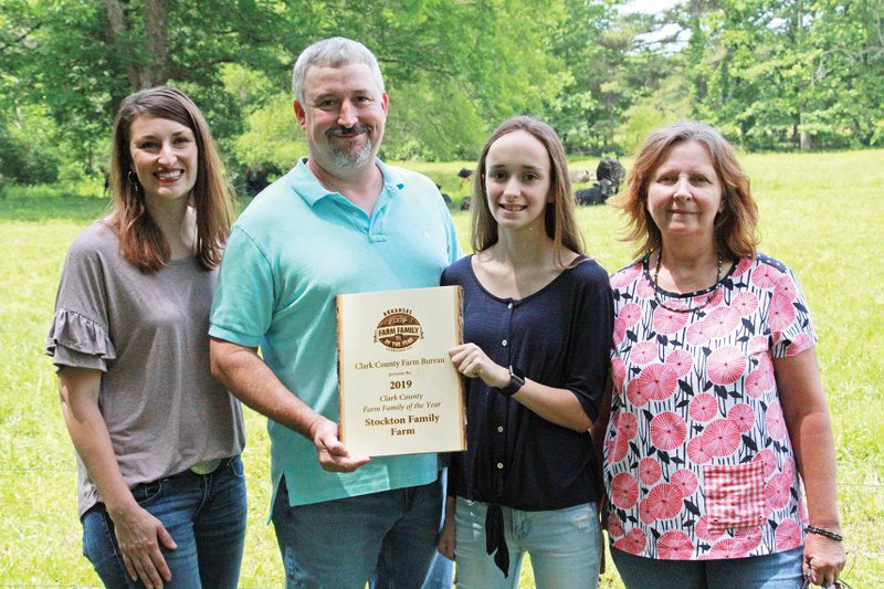 The Stockton family of the Okolona community was selected as Clark County Farm Family of the Year. From left are Bethany Stockton, Dustin Stockton, daughter Georgia Kate and Dustin’s mother, Pat Rowe. The family raises hay, timber and livestock on 550 acres that have been in the family for 135 years. 
