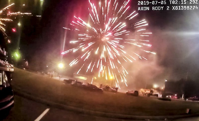 A frame grab from a Pulaski County sheriff’s deputy’s body camera video shows a fireworks explosion set off early Friday morning in College Station during a "fireworks war" that left several people injured. Video is available at arkansasonline.com/76fireworks/. 