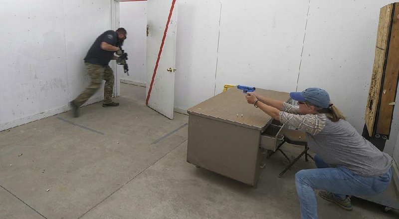 Christy Belt, a fifth-grade teacher in Utah, engages in an exercise in late June at the Utah County sheriff’s office shooting range designed to help teachers make good decisions in high-stress situations. 