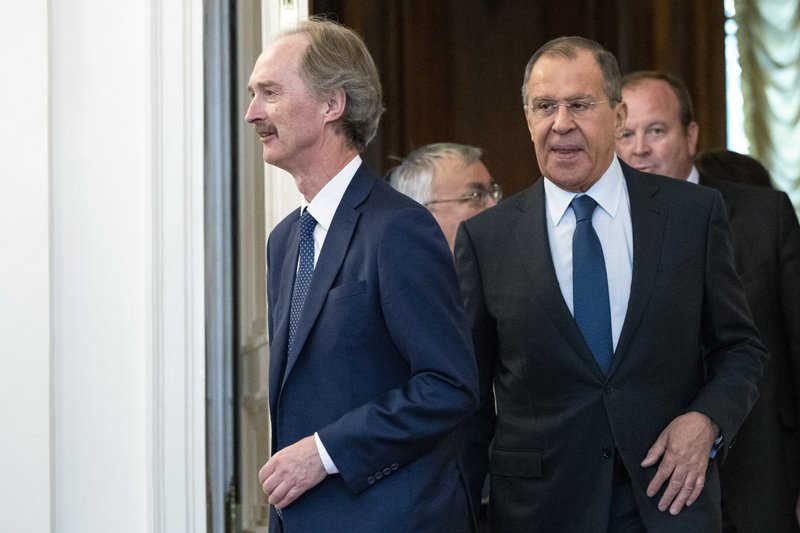 United Nations Special Envoy for Syria Geir Pedersen, center, and Russian Foreign Minister Sergey Lavrov, second from right, enter a hall during their meeting in Moscow, Russia, Friday, July 5, 2019. Pedersen voiced hope that cooperation between Russia and Turkey will help stabilize the situation in Syria's northwestern provice of Idlib. (AP Photo/Pavel Golovkin)