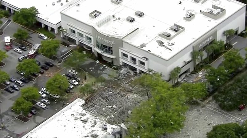 This image taken from video provided by WPLG shows debris covering the parking lot of a shopping center after an explosion on Saturday, July 6, 2019 in Plantation, Fla. The explosion happened Saturday morning at the shopping center, west of Fort Lauderdale in Broward County. The blast sent large pieces of debris about 100 yards across the street. 
