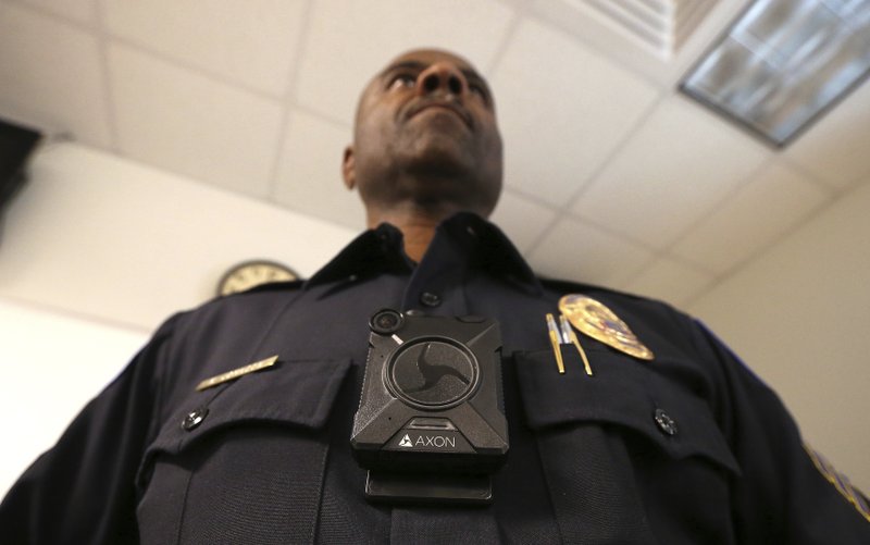 Phoenix Police Department Sgt. Kevin Johnson shows off the new Axon Body 2 body camera in this July file photo. Little Rock police officers have been testing body cameras, though they haven't specified what types or vendors they've used. (AP Photo/Ross D. Franklin)