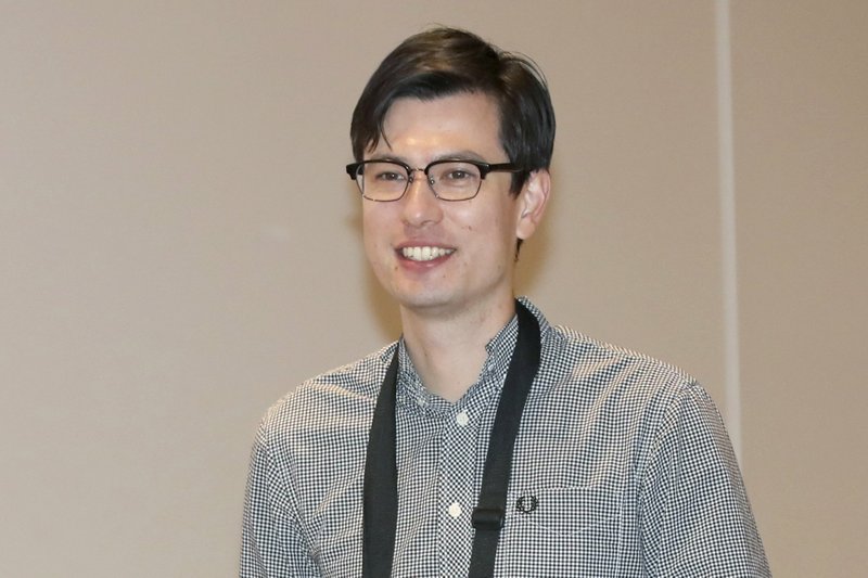 In this July 4, 2019 photo, Australian student Alek Sigley arrives at the airport in Tokyo. 