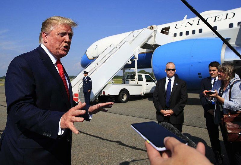 President Donald Trump, shown speaking to reporters in Morristown, N.J., before returning to Washington on Sunday, tweeted a defense of his administration’s response at the southern border. 