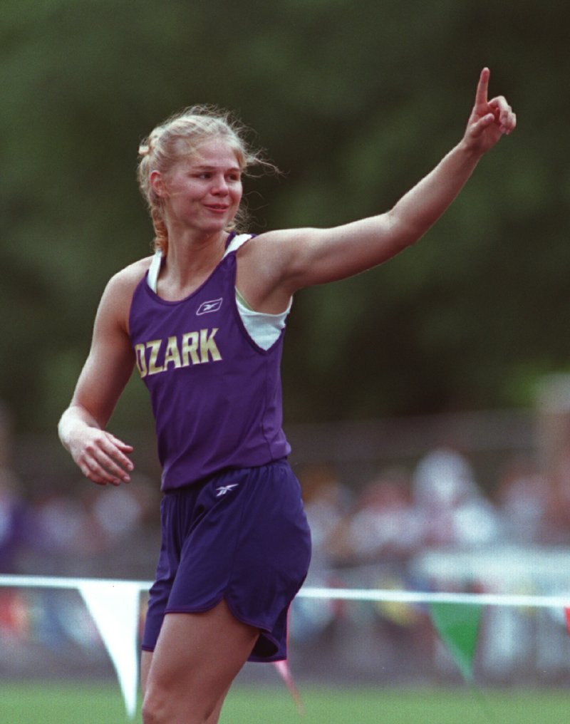 5/9/02
Arkansas Democrat-Gazette/STEPHEN B. THORNTON
Ozark's Sarah Pfeifer acknowledges the crowd after winning the AAA girls high jump at the State Track and Field Championships Thursday afternoon at Hot Springs High School.