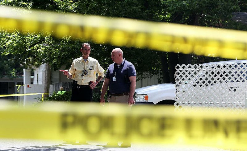 Little Rock police detectives investigate at 15th and Elm streets Monday after a death that authorities said is being regarded as suspicious. 