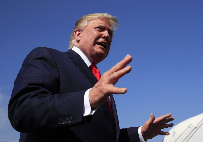 FILE - In a Sunday, July 7, 2019 file photo, President Donald Trump speaks at Morristown Municipal Airport in Morristown, N.J. resident Donald Trump's New York state tax returns could be given to Congress under a new law in his home state. The measure was signed into law Monday, July 7, 2019 by Democratic Gov. Andrew Cuomo.(AP Photo/Manuel Balce Ceneta, File)