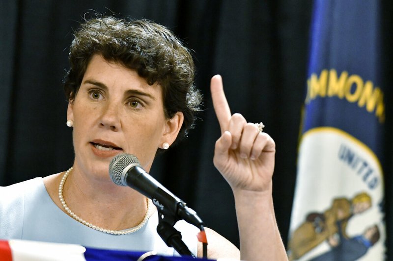 In this Aug. 18, 2018 file photo, Amy McGrath speaks to supporters during the 26th Annual Wendell Ford Dinner in Louisville, Ky. McGrath, a Marine combat aviator who narrowly lost a House race to an incumbent Republican in Kentucky, has set her sights on an even more formidable target: Senate Majority Leader Mitch McConnell. (AP Photo/Timothy D. Easley)
