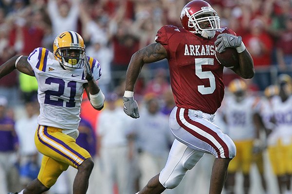 Arkansas running back Darren McFadden runs for an 80-yard touchdown during a game against LSU on Friday, Nov. 24, 2006, in Little Rock. The Razorbacks unveiled throwback uniforms Tuesday that are replicas of those worn by Arkansas from 2005-07. 
