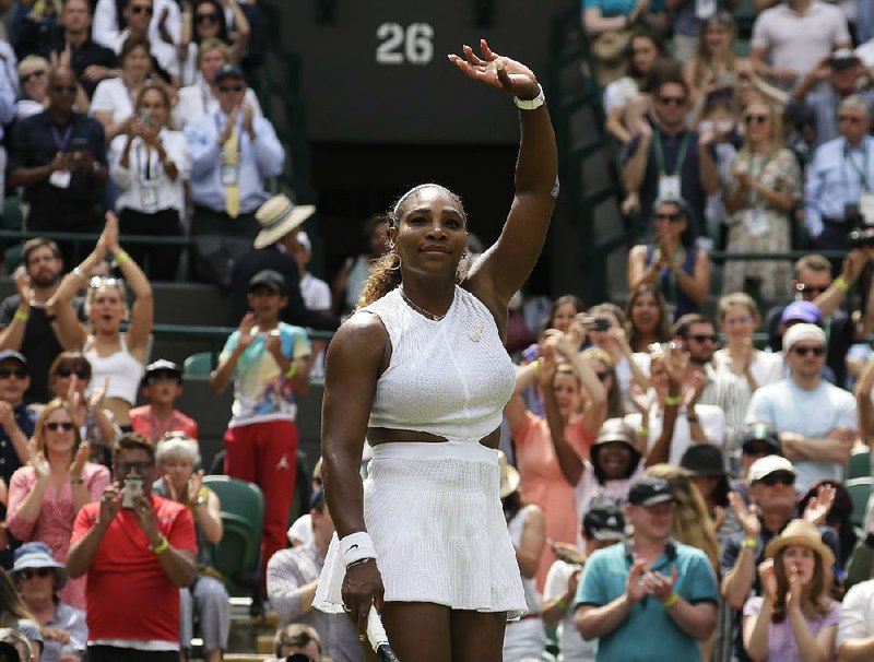 United States' Serena Williams waves after defeating Carla Suarez Navarro in a women's singles match during day seven of the Wimbledon Tennis Championships in London, Monday, July 8, 2019. 