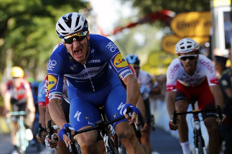 Elia Viviani of Italy crosses the finish line to win Stage 4 of the Tour de France on Tuesday in Nancy, France. It was Viviani’s first Tour stage victory. 
