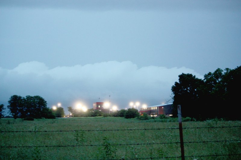 MARK HUMPHREY ENTERPRISE-LEADER Lights glow at Farmington's new football stadium during a recent rainstorm on a view from Clyde Carnes Road. Heavy rainfall slowed down various construction projects across the area and forced some road closures due to flooding in June.