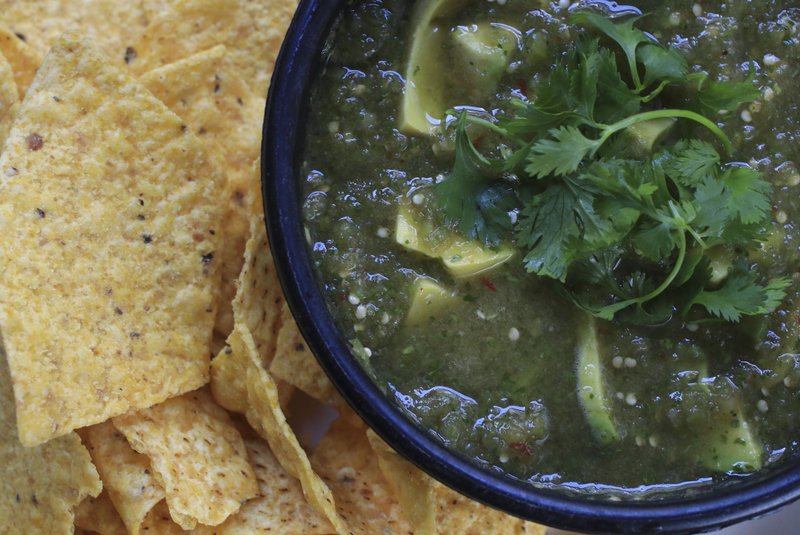 Fresh Tomatillos and Chipotle Salsa combines tomatillos, onion, canned chipotle in adobo, cilantro and avocado. Serve it with chips or as a sauce for grilled meats, chicken or fish. Photo by Staton Breidenthal