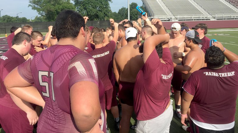Graham Thomas/Herald-Leader Members of the Siloam Springs football team call it up after a workout on Monday morning at Panther Stadium.