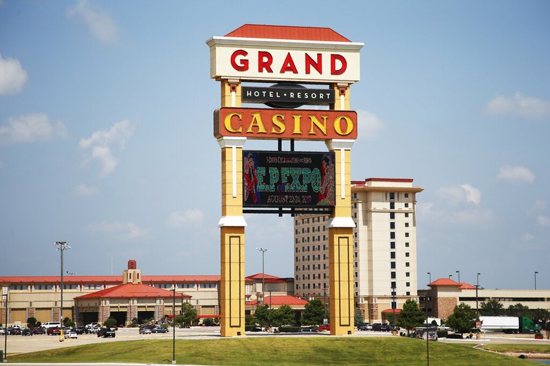 This photo shows the Grand Casino and Resort in Shawnee, Okla, Wednesday, July 10, 2019. Leaders with Oklahoma's powerful Native American tribes are voicing frustration with the state's Republican governor after they say he caught them off guard with plans to force renegotiations for a bigger piece of the billions of dollars tribal casinos generate each year. (AP Photo/Sue Ogrocki)