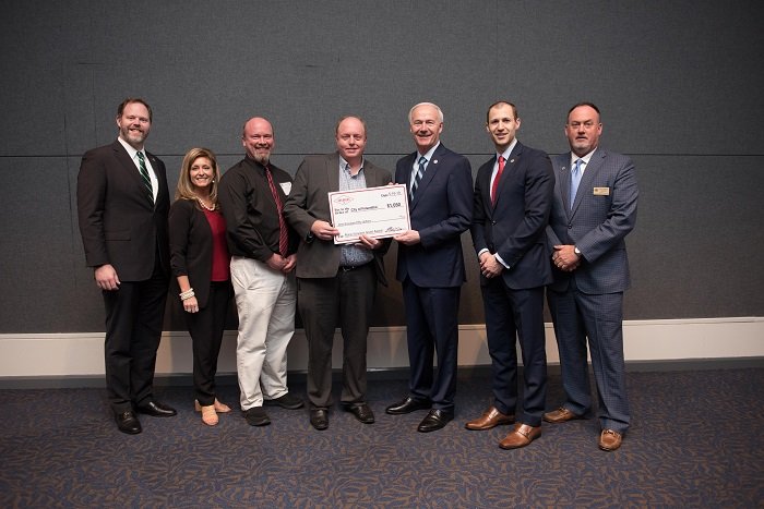 Officials from the city of Felsenthal received a grant from AEDC officials and Gov. Asa Hutchinson.