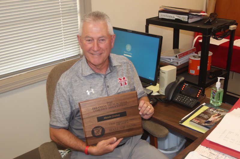 Marvin Lindsey Jr., who retired as Magnolia School District’s athletic director this year, holds the plaque presented to him after being inducted into the 2018 Arkansas High School Coaches’ Association Hall of Fame. He will be inducted into the 2019 Arkansas High School Athletic Administrator’s Hall of Fame on Friday in Hot Springs.