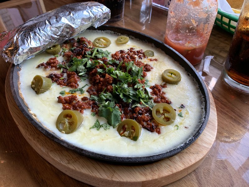 The Choriqueso at El Mezcal Mexican Bar & Grill, cheese dip with chorizo sausage and fresh jalapenos served on a skillet, is similar to queso fundido. Arkansas Democrat-Gazette/Eric E. Harrison
