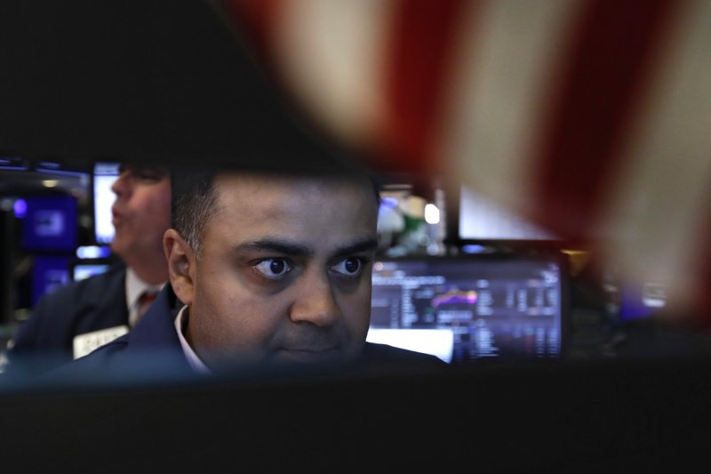  In this June 18, 2019, file photo specialist Dilip Patel works at his post on the floor of the New York Stock Exchange. (AP Photo/Richard Drew, File)